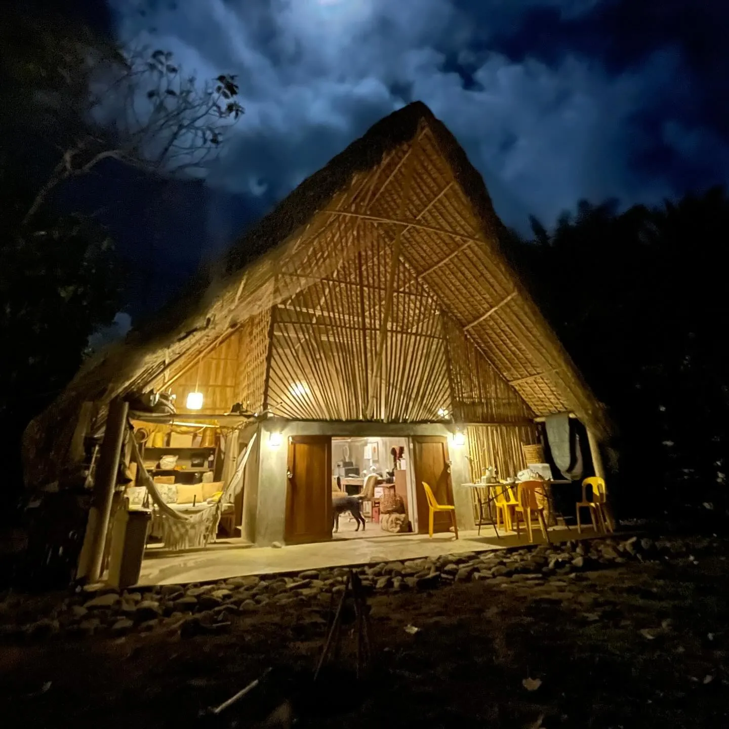 Bugiw Cottage lit up at night